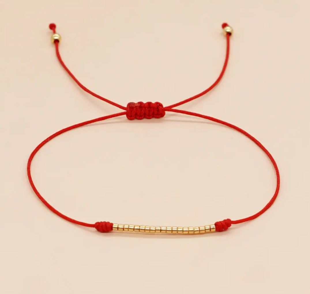 Bracelet wiht gold and red very symbolic